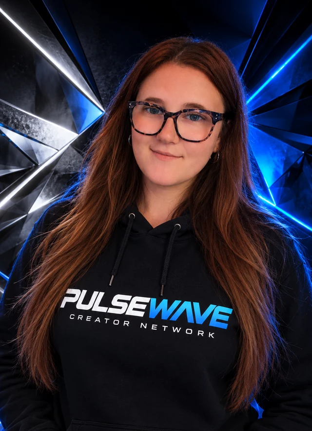 Nai, Pulse Wave founder, wearing glasses and a Pulse Wave branded hoodie